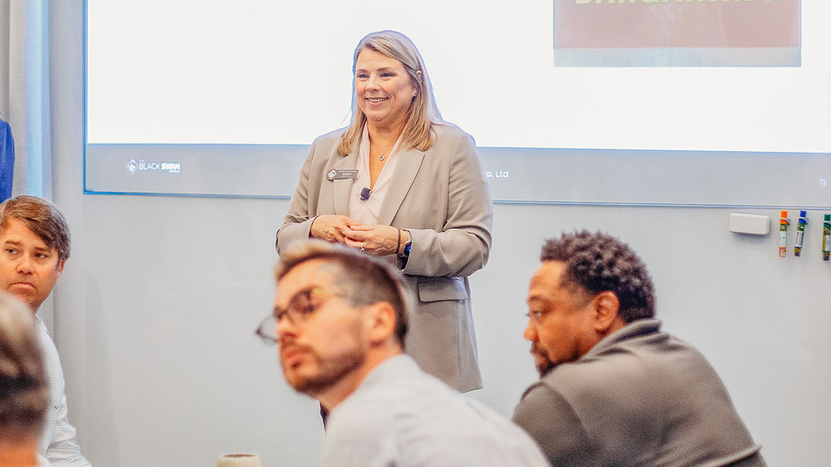 Sandy Hein hosting a seminar. 